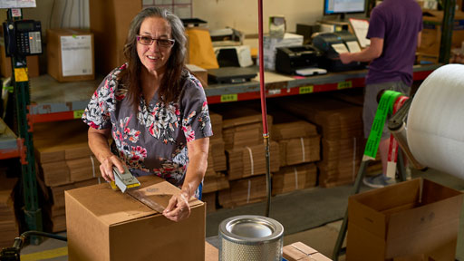 Allmand employee working in shipping and receiving